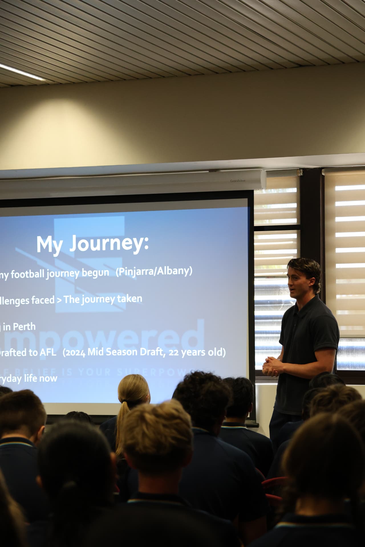 Jacob Blight presenting his journey to a school assembly